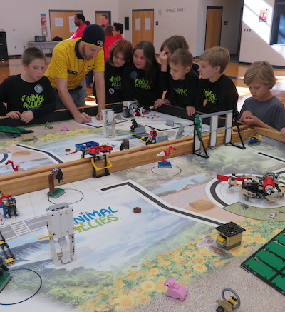 Students working together on a LEGO robot